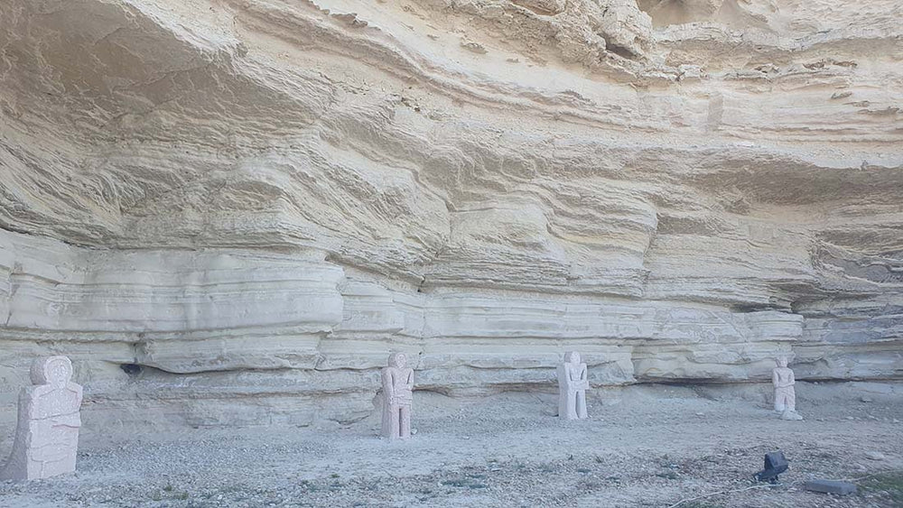 stone figures carved in the 10th century in a cave overlook the Caspian sea guarding Kazakhstan.