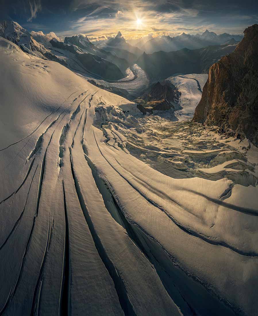 ariel view of glacier in Zermatt Switzerland. Snowy mountains at sunrise.