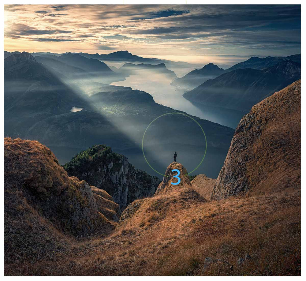 a raw-file shows good balance in a mountain scene with a person standing on the edge of a cliff.