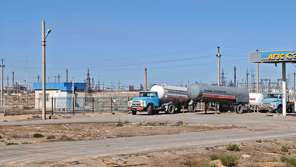 gas trucks refueling an abandoned gas station in southwest kazakhstan.