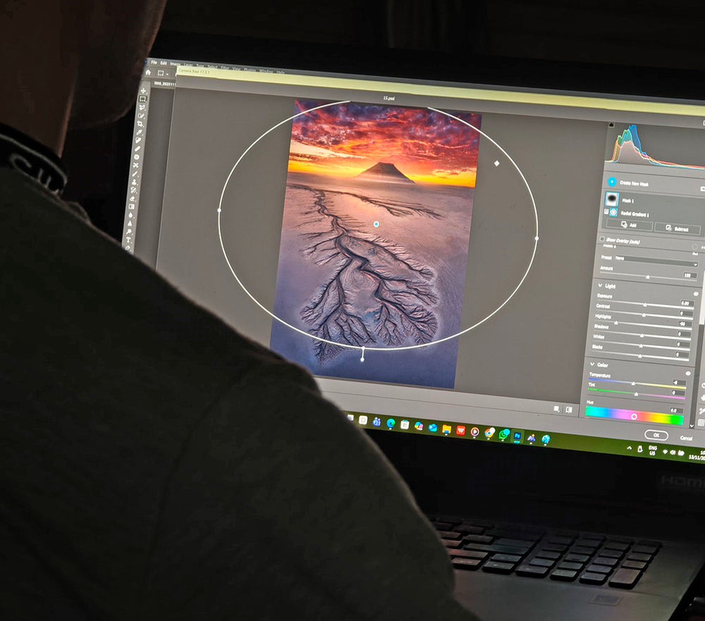 Handsome Max Rive shows how he edits a photo from Kazakhstan on his laptop using photoshop.