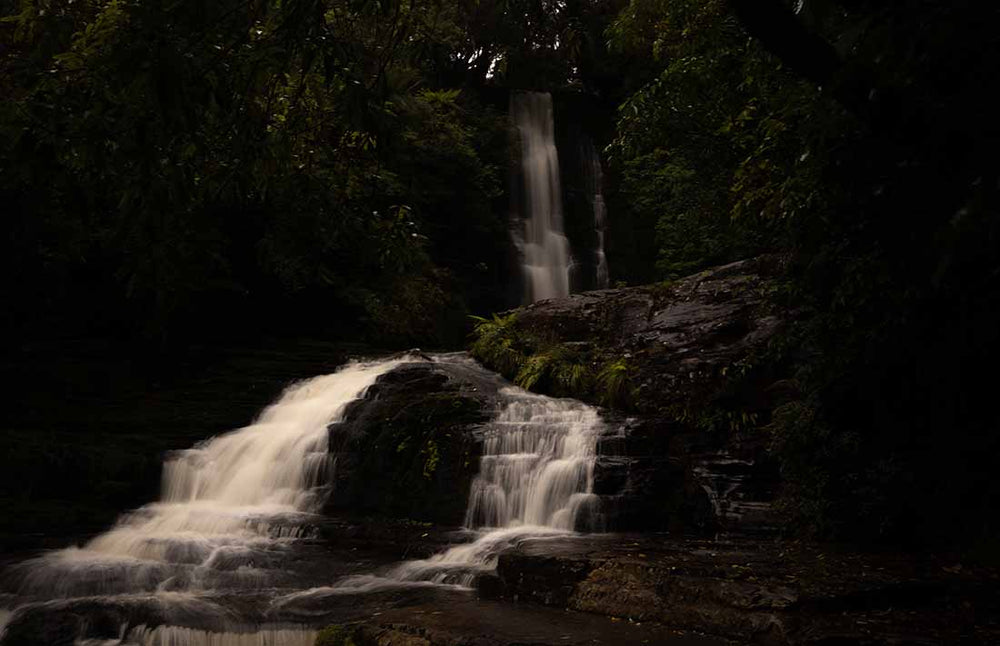 underexposed image of a waterfall raw file image taken in France.