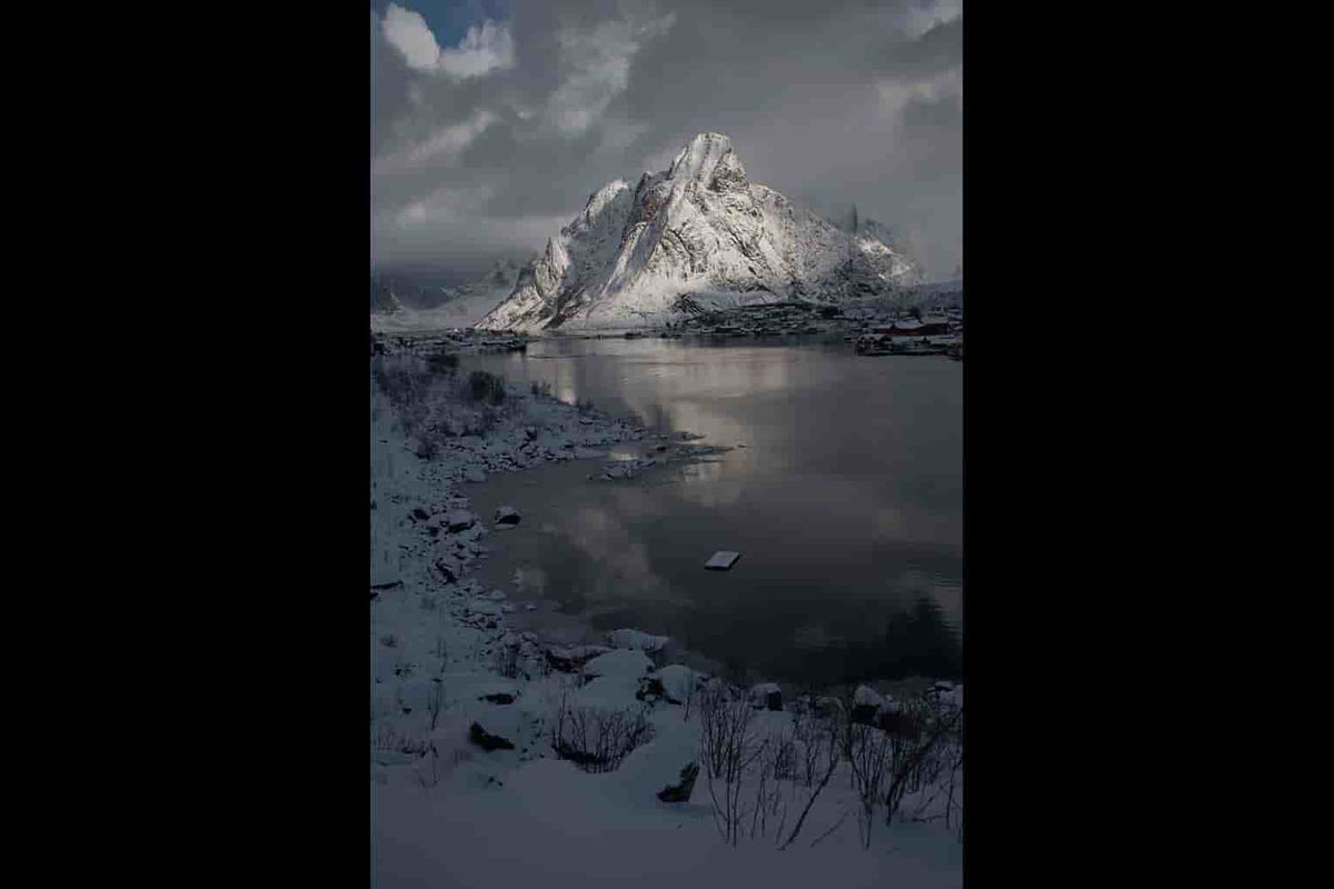 Reine fjordview on white mountain in winter - winter and cold lightroom presets - raw