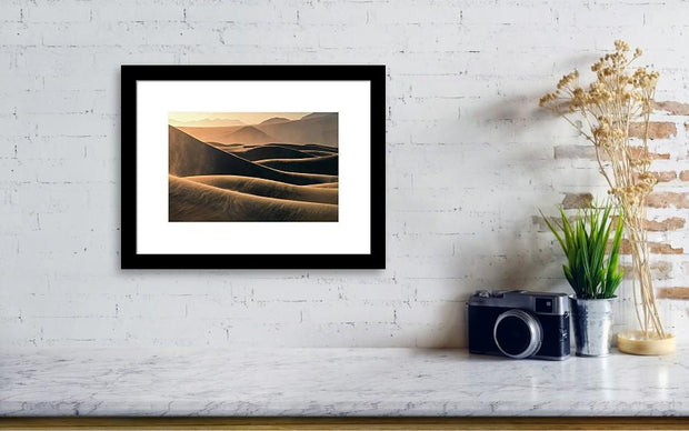 Framed Print hanged on wall of Mesquite flat sand dunes wtih blowing sand at sunrise