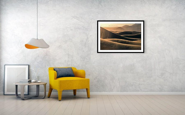 Framed Print hanged on wall of Mesquite flat sand dunes wtih blowing sand at sunrise living room