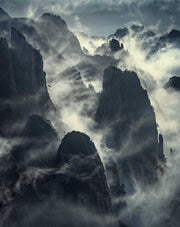 China Mountains landscape with cloudy conditions around vertical mountain walls