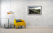 green hills framed print hanged on wall in room