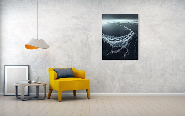 medium print hanged on wall of maelifell volcano with dark sky with river delta from the air