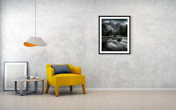milford sound waterfall framed print hanged on wall in living room