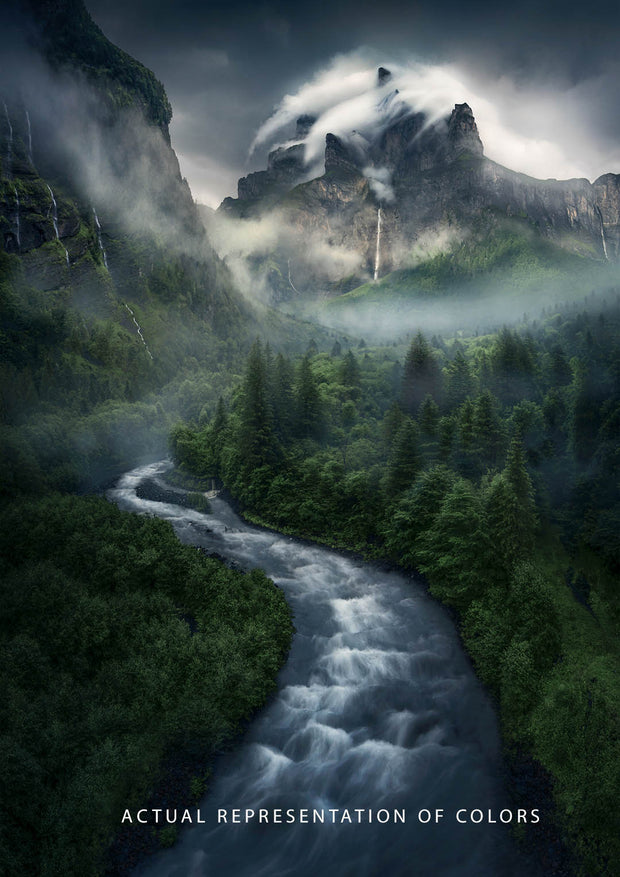 Green forest with waterfall and misty mountains seen from above - waterfall and pointy peaks