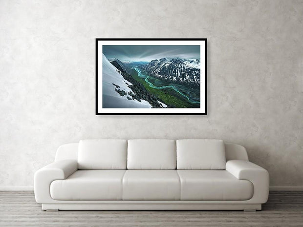 Rapadalen framed print hanged in living room - showing the rapa vallay in sarek national park with snow and green colors