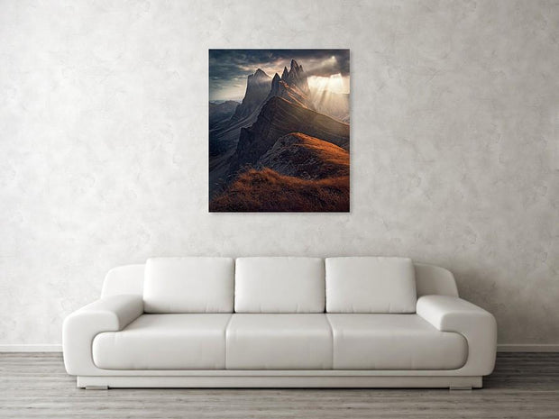 Hanged on wall print of Dramatic light rays above the autumn colored seceda mountain in the dolomites, Italy
